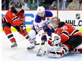 Some say the Oilers should target New Jersey defenceman Adam Larsson, left.
