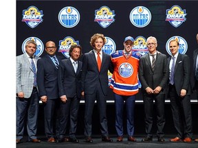 Connor McDavid poses on stage after being selected first overall by the Edmonton Oilers in the first round of the 2015 NHL Draft at BB&T Center on June 26, 2015 in Sunrise, Florida.