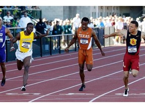 Canadian sprinter Andre De Grasse, right, edges out, from left, Texas Christian’s Kolby Listenbee, Baylor’s Trayvon Bromell and Texas’ Senoj-Jay Givans to win the 100-metre dash during the NCAA track and field championships in Eugene, Ore., Friday, June 12, 2015.