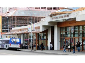 A bus stops outside the Stanley Milner Library.