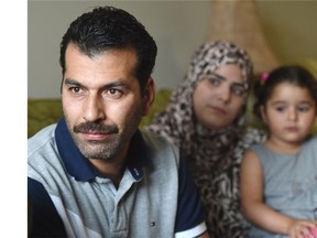 Syrian refugees Mohammad Al Jammal and his wife Heba Al Haffar and their daughter Nahed, 3, in Edmonton on Friday June 12, 2015