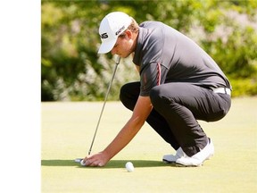 Tyler Saunders practising his putting at the Glendale golf course on July 21, 2014 .