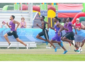 U.S.A.’s Wallace Spearmon, far left, wins the men’s 200-metre sprint competition with a time of 20.21 seconds during the Track Town Classic at Foote Field on Sunday.