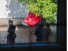 A woman’s body was found in a shopping cart in a driveway behind a home on 124th Street between 113th Avenue and 114th Avenue on Tuesday.
