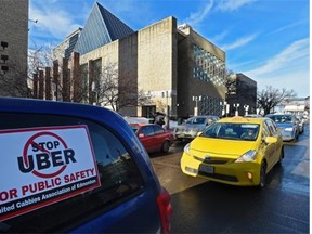 About 150 taxi drivers held a protest outside City Hall over concerns about unfair competition from Uber in Edmonton, January 14, 2015. (ED KAISER/EDMONTON JOURNAL)