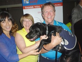 Azin Soltani, Anne McLellan, Dave Mowat and dog Vaughan at the Aga Khan Foundation’s World Partnership in Golf tournament.
