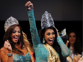 Mrs. Canada Ashley Burnham, centre, celebrates after being crowned Mrs. Universe during the Mrs. Universe 2015 pageant final in Minsk on Aug. 29, 2015.
