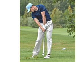 Brett Hogan of Calgary hits a shot from the 18th fairway during Monday’s first round of the Alberta men’s amateur golf championship at the Edmonton Petroleum Golf & Country Club.