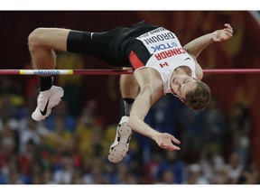 Canada's Derek Drouin clears the bar in the men's high jump final en route to winning the gold medal at the World Championships in Athletics at the Bird's Nest Stadium in Beijing on Aug. 30, 2015.