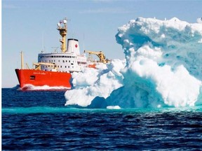 The Canadian Coast Guard icebreaker Louis S. St-Laurent sails past a iceberg in Lancaster Sound in this July 11, 2008 file photo.  Just because Arctic thaws and prairie droughts have happened before doesn’t mean we shouldn’t try to mitigate the human causes of climate change, writes Ryan Orchard.