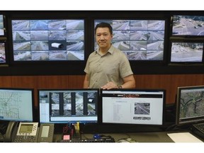 Wai Cheung, Advanced Traffic Technology Specialist, in the City’s Traffic Management Centre, where major roadways can be viewed at the centre via traffic cameras across the city in Edmonton on Tuesday Aug. 4, 2105.