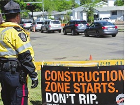 Const. Daniel Leach attends the kickoff of this year's road-construction safety campaign on Thursday. It urges drivers not to be "speeding losers."