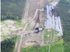 Crews work to clean an oil spill near Nexen’s Long Lake facility by Fort McMurray on Friday July 17, 2015. The spill was discovered by a contractor after the safety system designed to detect ruptures failed.