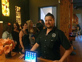 Nick Martin, general manager of Rostizado, says the new app NoWait helps manage customer disappointment over long wait times for a table at the popular restaurant.