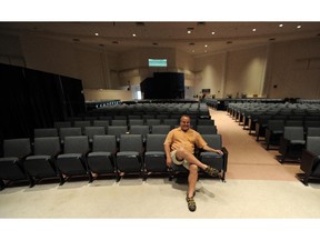 Lead Pastor Bruce Gritter sits in the main auditorium in the former Victory Christian Centre on Ellerslie Road in Edmonton in July 2014. City council has put on hold a request to turn the building into a community centre.