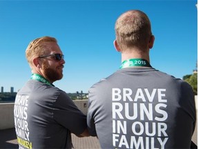 Chris (left) and Mike Roy ran the 10km race in honour of their late father Kevin Roy who was an avid runner, in Edmonton on August 23, 2015.