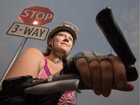 Cyclist Jackie Pearce would like traffic laws changed so bicycles can treat stop signs as yields. She poses for a photo in Edmonton on Aug. 26, 2015.