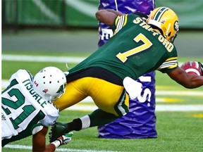 Edmonton Eskimos Kenny Stafford dives towards the goal-line to score a touchdown against the Saskatchewan Rough Riders in a Canadian Football League game at Commonwealth Stadium on July 31, 2015.