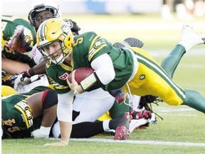 Edmonton Eskimos quarterback Jordan Lynch dives into the end zone to score a touchdown against the Ottawa Redblacks during a Canadian Football League game at Commonwealth Stadium on July 9, 2015.