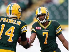 Edmonton Eskimos receiver Kenny Stafford hands the ball to quarterback James Franklin after scoring a touchdown against the Winnipeg Blue Bombers during Saturday’s Canadian Football League game at Commonwealth Stadium.