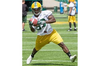 Edmonton Eskimos rookie running back Shakir Bell carries the ball during the Canadian Football League team’s training camp at Fuhr Sports Park in Spruce Grove on June 10, 2015.
