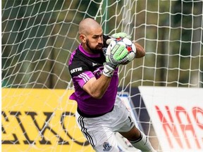 FC Edmonton goalkeeper Matt VanOekel makes a save against the Minnesota United FC in a North American Soccer League game on May 3, 2015, at Clarke Field.