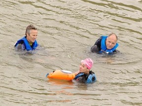 Edmonton Journal city columnist David Staples (right), riverkeeper’s Glenn Isaac (centre) and Steph Neufeld (left) swim in the North Saskatchewan River from west of Whitemud Equine centre to the Kinsmen Sport Centre to demonstrate the cleanliness of the river.