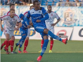 FC Edmonton’s Tomi Ameobi scores on a penalty kick during Wednesday’s 2-0 victory over Indy Eleven in a North American Soccer League game at Clarke Field on Aug. 5, 2015.