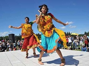 Sisters Tanishka Gupta (front) and Sooravi Gupta perform a folk dance at the India pavilion at the 37th Annual Edmonton Heritage Festival at Hawrelak Park in Edmonton on Saturday August 4, 2012.