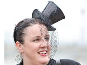 Erin Ward wears a top hat the Canadian Derby at Northlands Park in Edmonton August 15, 2015.