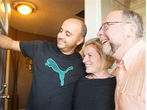 Fadi, left, takes a selfie with Premier Rachel Notley and Bob Hawkesworth, NDP candidate for Calgary-Foothills, during door-knocking in Calgary on Aug. 19, 2015. No matter who voters choose on Sept. 3, the price of oil won’t bounce back and the NDP government isn’t about to have any solutions to the financial headaches stemming from that drop, writes Graham Thomson.