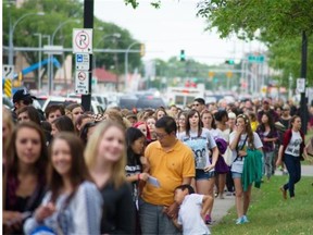 Fans wait outside Commonwealth Stadium for the start of One Direction’s first concert in Edmonton on July 21, 2015. Many fans complained about long lineups and poor access to floor seating at the venue.