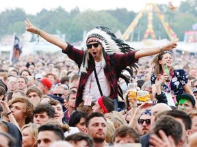 A festival goer in an indigenous headdress at the Isle of Wight Festival on Friday, June 12, 2015 in Newport, Isle of Wight, England. Wearing fake headdresses at music festivals has become an unfortunate fashion statement for young hipsters around the world.