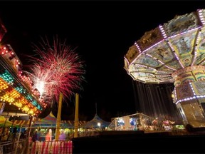 Fireworks light up the Edmonton skies above the already bright K-Days midway on July 19, 2015. In an economic downturn, people stend to stick close to home ­— all the more reason to check out K-Days and other festival and sporting events, the Journal says in an editorial.