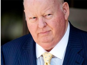 Former Conservative Senator Mike Duffy leaves the courthouse in Ottawa, following the sixth day of testimony by Nigel Wright, former chief of staff to Prime Minister Stephen Harper, on Wednesday, Aug. 19, 2015. Duffy faces 31 charges of fraud, breach of trust, bribery, frauds on the government related to inappropriate Senate expenses.