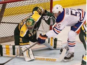 Former Edmonton Oilers’ first-round draft pick Leon Draisaitl can get the puck past University of Alberta Golden Bears goaltender Kurtis Mucha during an exhibition game at Clare Drake Arena on Sept. 16, 2014.
