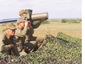 From left, bombardiers Gary Williams and Jim Klein and gunner Axel de Jonge of the 18th Air Defence Regiment take aim with a surface-to-air missile during a 1995 training exercise at the Wainwright Regional Training Area. Camp Wainwright opened in 1943.