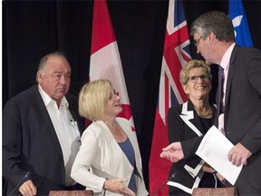 From left, N.W.T. Premier Bob McLeod, Alberta Premier Rachel Notley, Ontario Premier Kathleen Wynne and Nova Scotia Premier Stephen McNeil bid their farewells at the closing news conference of the summer meeting of Canada’s premiers in St. John’s on Friday, July 17, 2015.