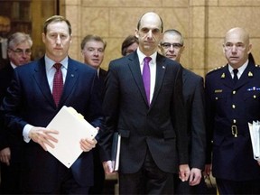 From left in this March 2015 file photo, Justice Minister Peter MacKay, Public Safety Minister Steven Blaney, CSIS director Michel Coulombe and RCMP Commissioner Bob Paulson arrive at the Commons public safety committee, which is hearing witnesses on Bill C-51, the Anti-terrorism Act, on Parliament Hill in Ottawa.