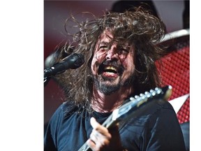 Frontman Dave Grohl of Foo Fighters in concert at Rexall Place in Edmonton, August 12, 2015.