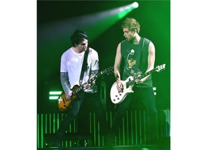 Frontman Luke Hemmings, right, and Michael Clifford of 5 Seconds of Summer in concert at Rexall Place in Edmonton on July 27, 2015