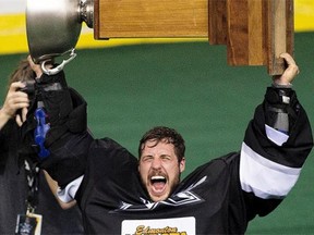 Goaltender Aaron Bold hoists the Champions Cup after the Edmonton Rush defeated theToronto Rock to win the National Lacrosse League title on June 5, 2015, at Rexall Place.