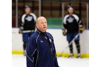 Hockey coach Serge Lajoie, watching players during NAIT Ooks practice in 2012, is the new head coach of the University of Alberta Golden Bears hockey program.