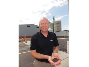 Jeff Vassart, president of Cargill Ltd. Canada, holds a handful of canola seed at the company’s new canola processing facility near Camrose on Wednesday, July 15, 2015.