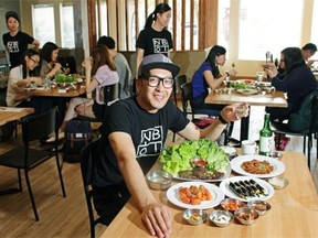 John Anh, owner of the Nongbu Korean Eatery, with some of the restaurant’s popular dishes