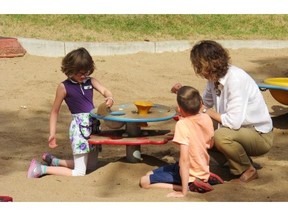 Katharina Staub, founder and executive director of Canadian Premature Babies Foundation, plays in the sand with her two children who were born prematurely in 2008.