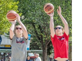 Katherine, right, and Michelle Plouffe from the Canadian senior women’s basketball team, show off their skills in preparation for the FIBA Americas Women’s championship taking place in Edmonton, Edmonton on July 29, 2015.