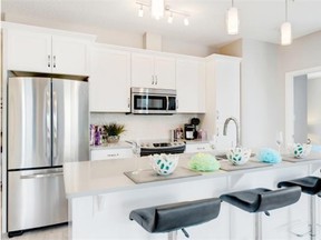 Kitchens offer stainless steel appliances and a ceramic subway backsplash.
