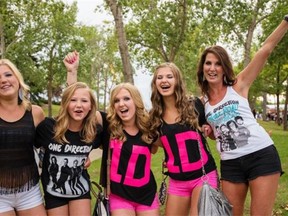 The Matson family waits outside Commonwealth Stadium for the start of One Direction’s first concert in Edmonton on July 21, 2015.