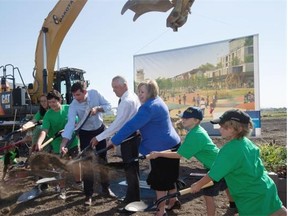 Mayor Don Iveson, Coun. Bev Esslinger and Mark Hall, the executive director of the Blatchford Redevelopment project, break ground on one of the world’s largest sustainable communities on August 12, 2015 in Edmonton.